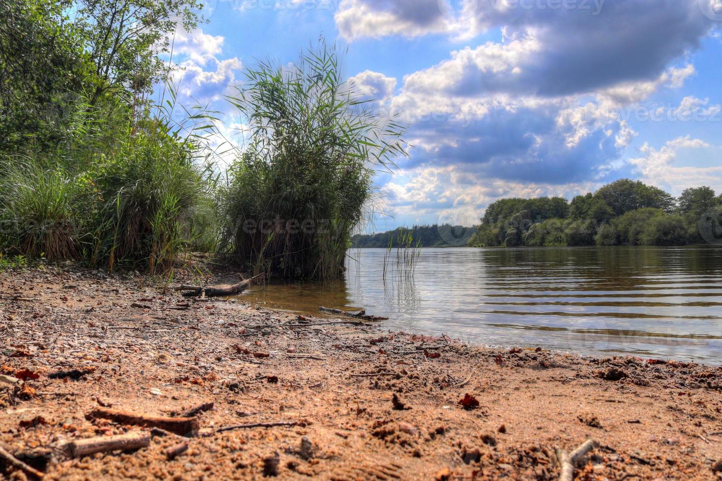 Beautiful landscape at a lake with a reflective water surface photo