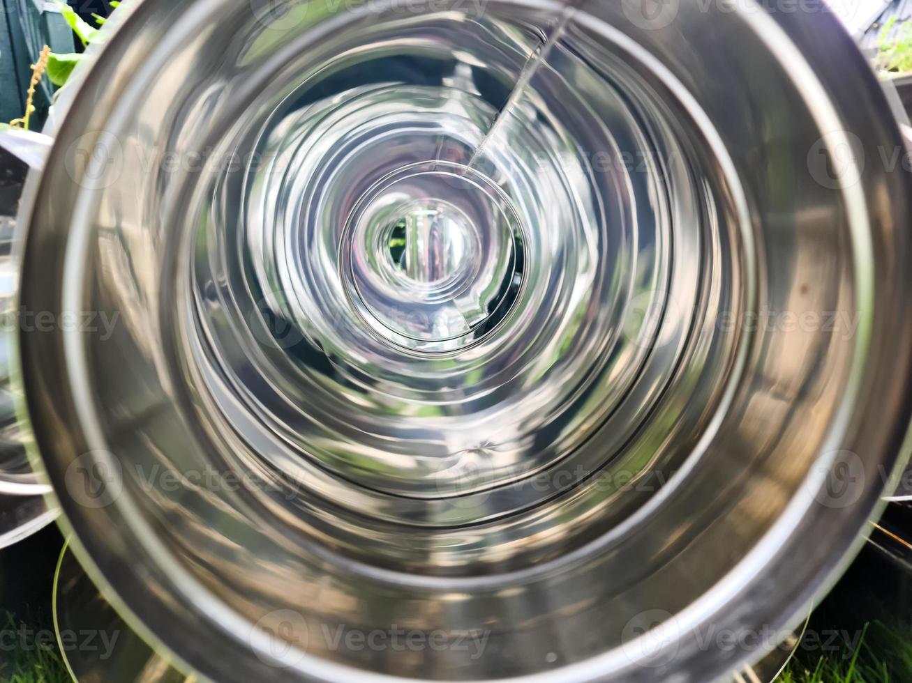 Close up view at a lot of reflective chrome metal tubes photo