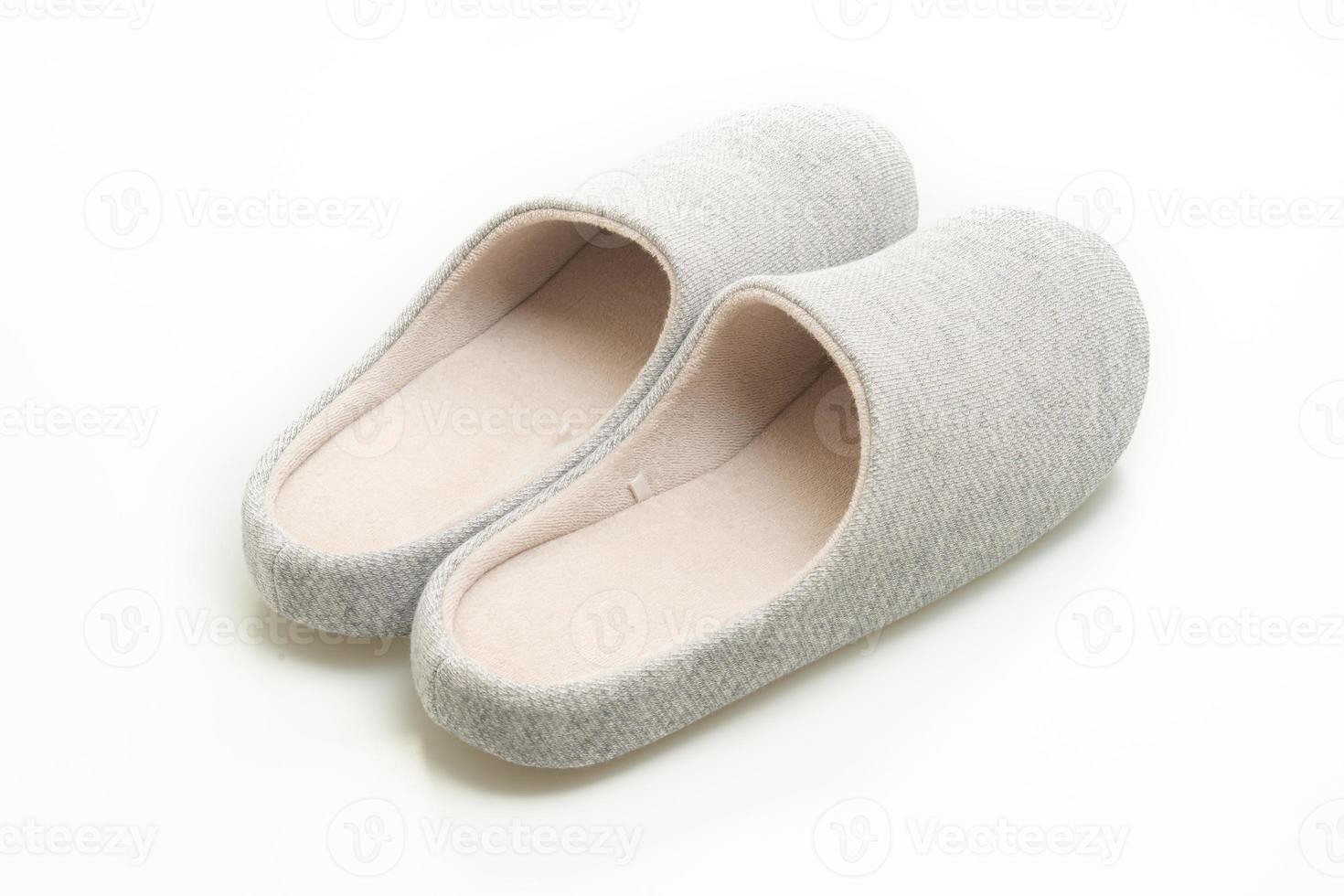 grey slipper on white background photo