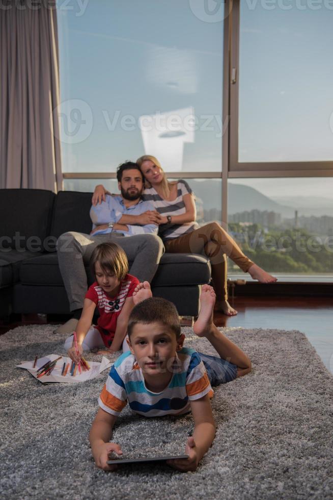 young couple spending time with kids photo