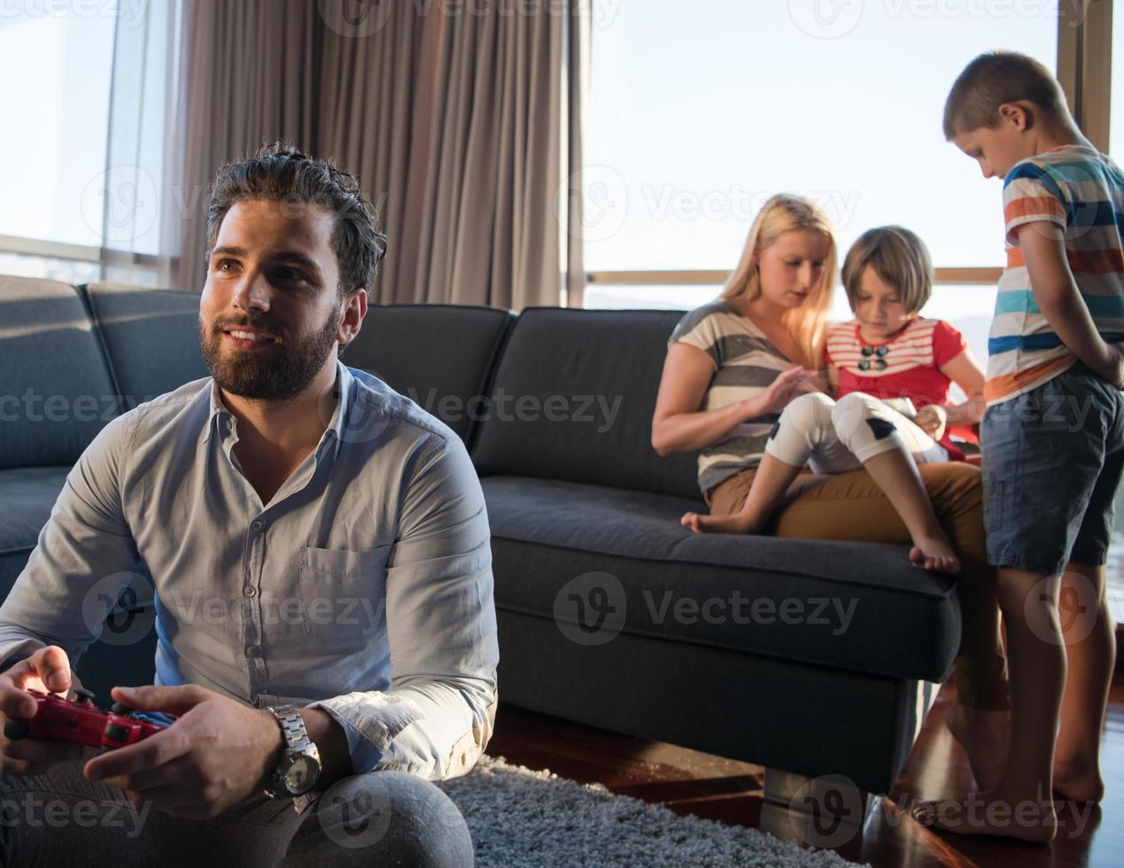 Happy family playing a video game photo