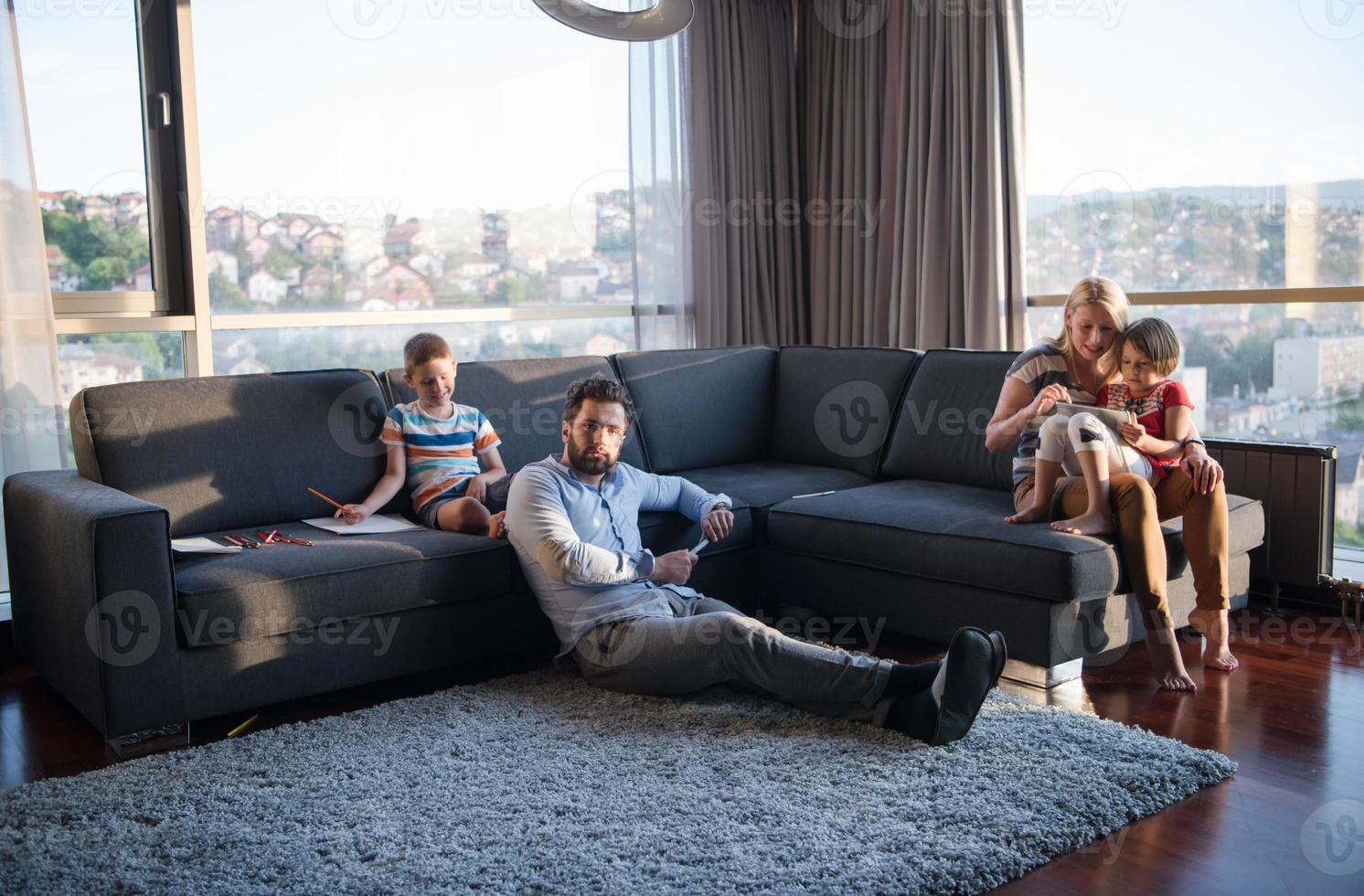 Happy Young Family Playing Together on sofa photo
