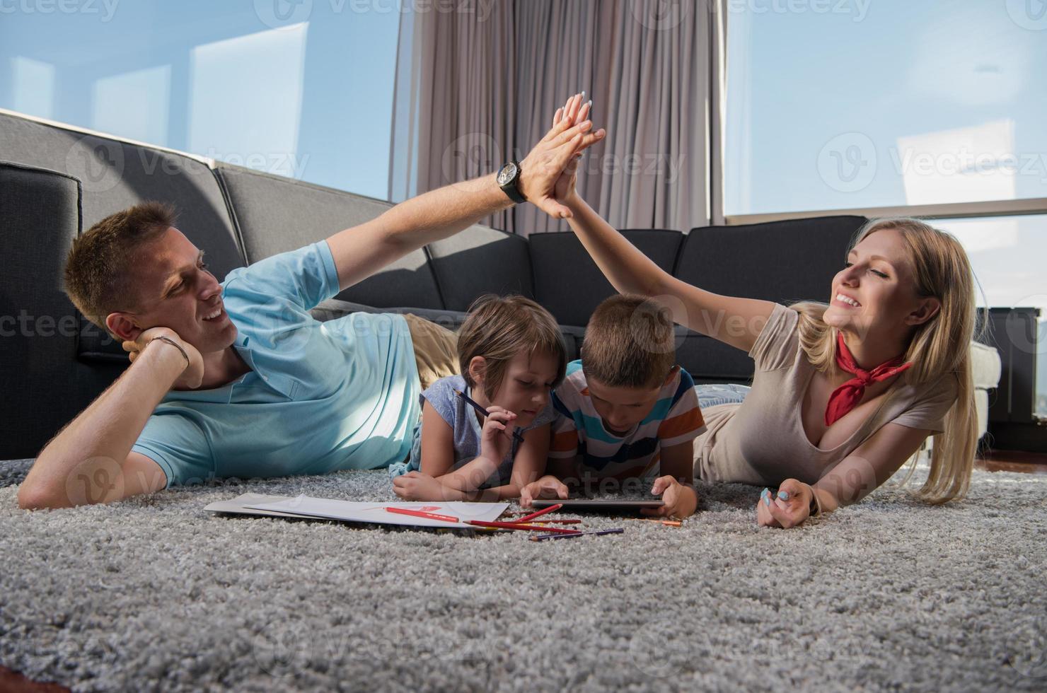 young couple spending time with kids photo
