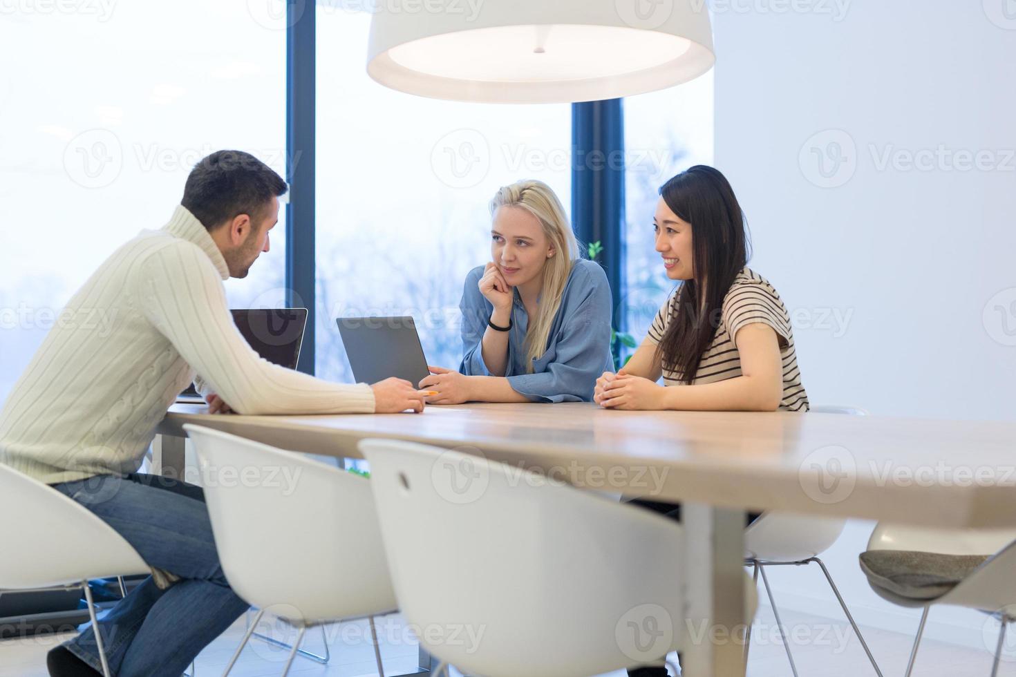 Startup Business Team At A Meeting at modern office building photo