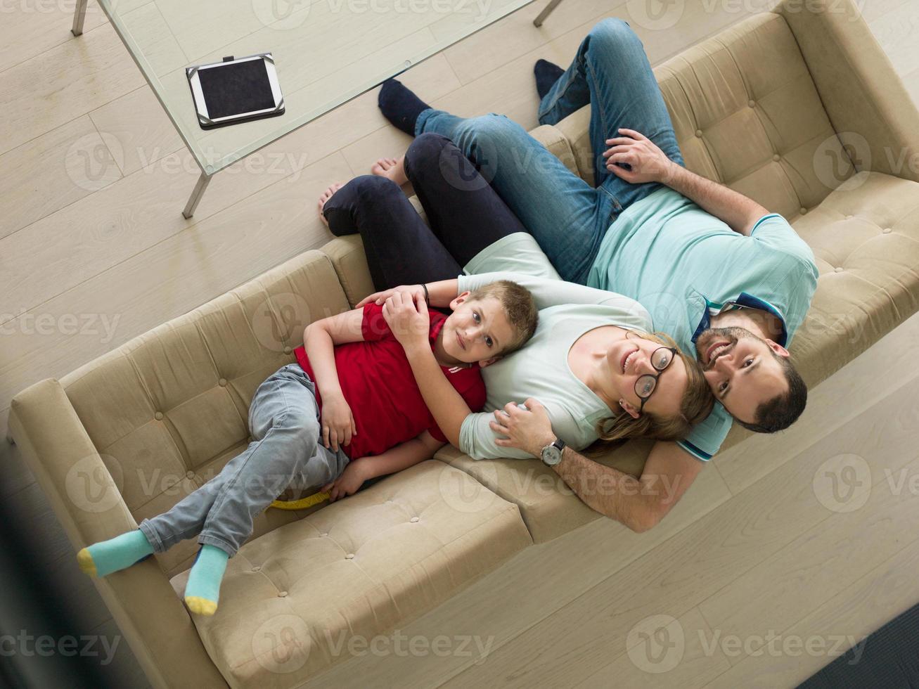 family with little boy enjoys in the modern living room photo