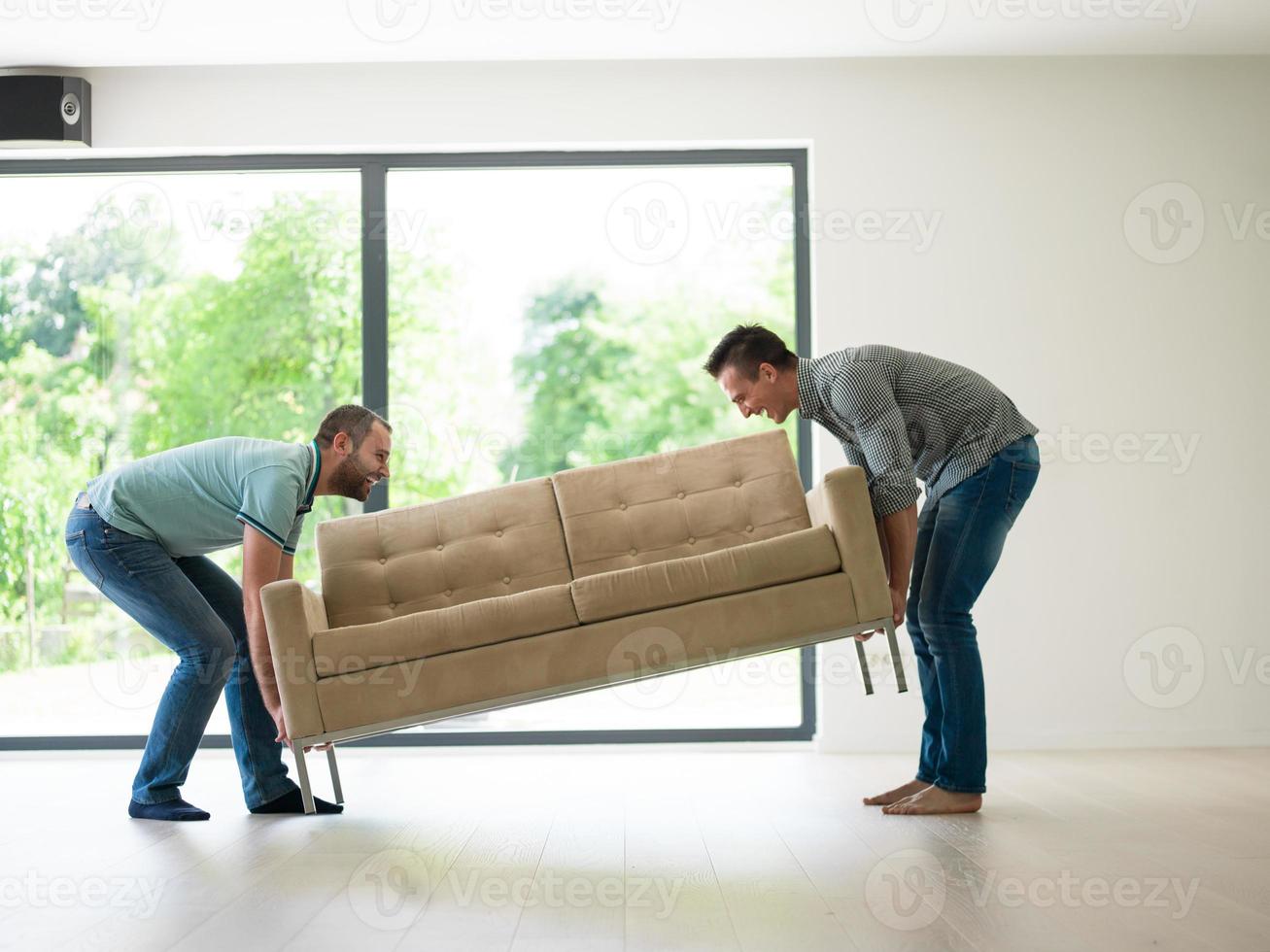 men carry the sofa photo