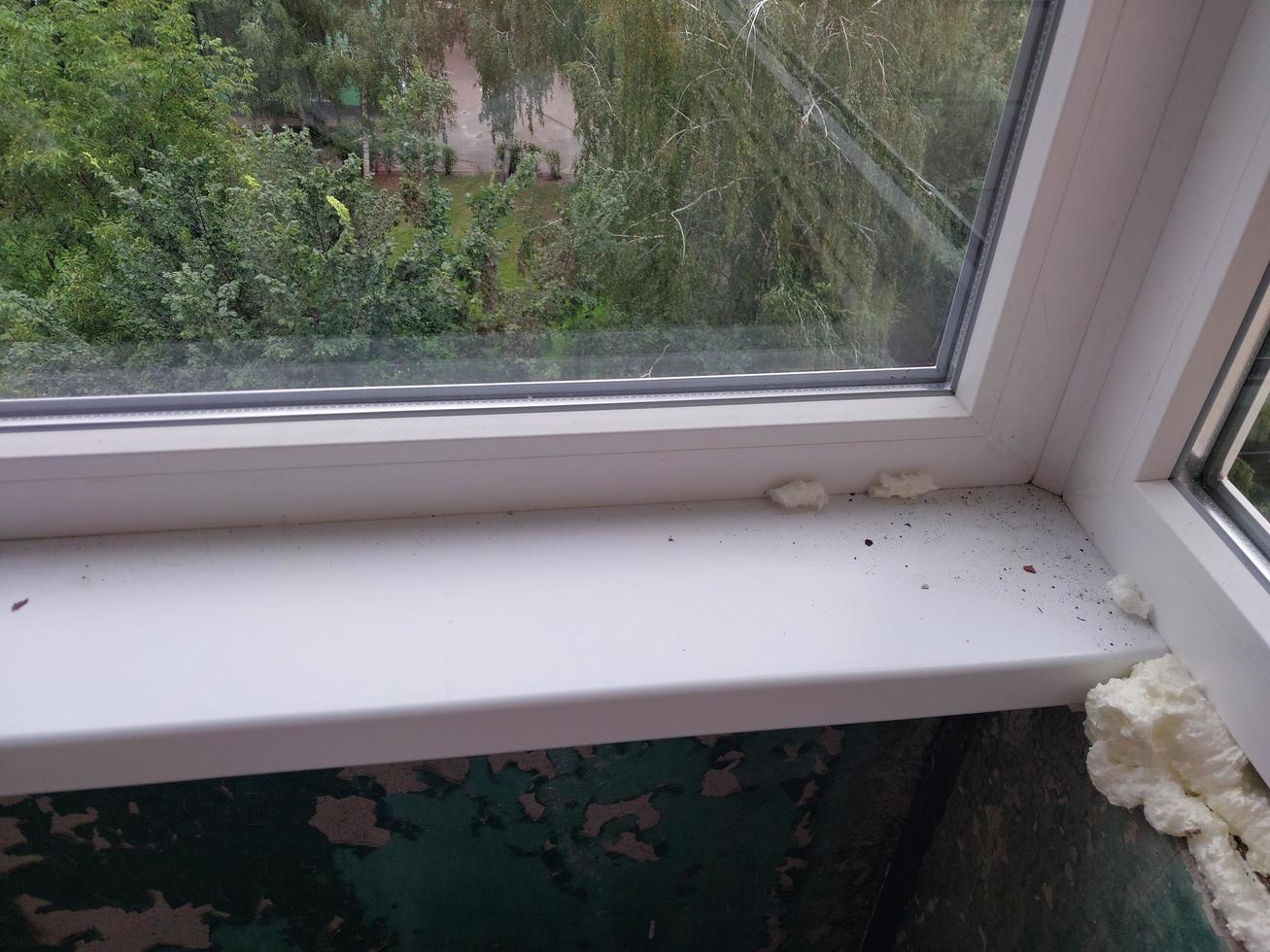 Installed metal-plastic windows on the balcony of a residential building photo