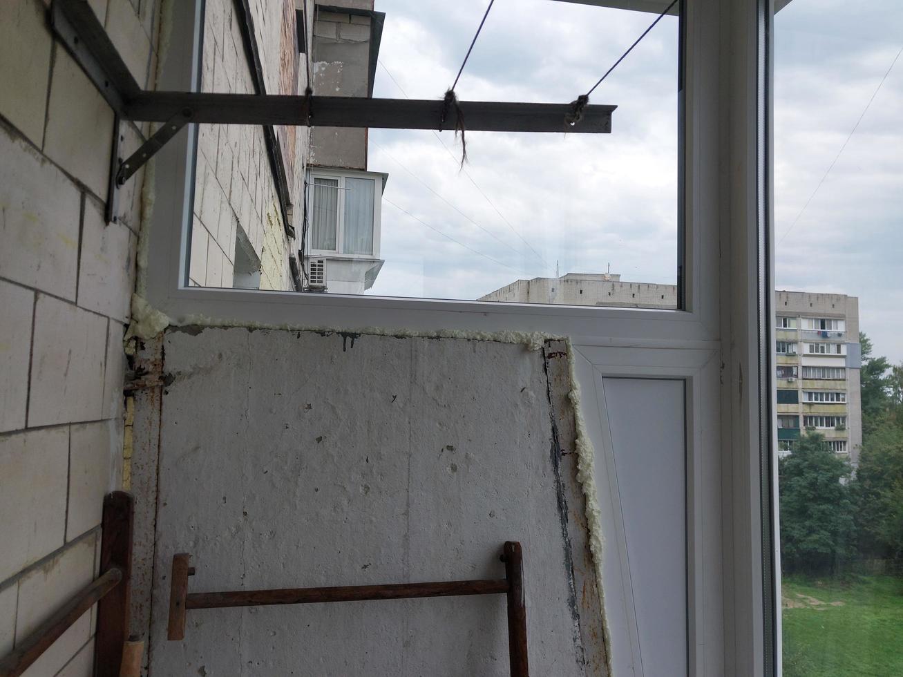 Installed metal-plastic windows on the balcony of a residential building photo