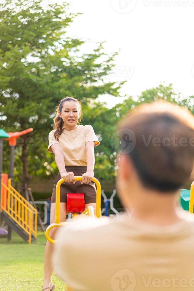 Asian couple love play seesaw photo