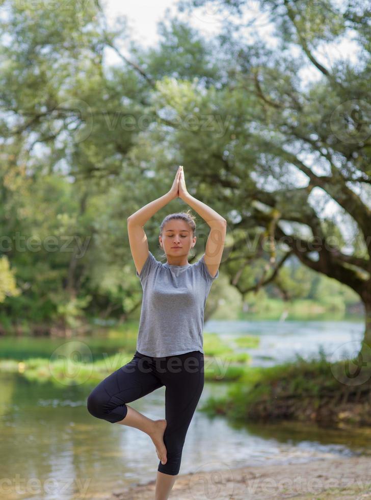 woman meditating and doing yoga exercise photo