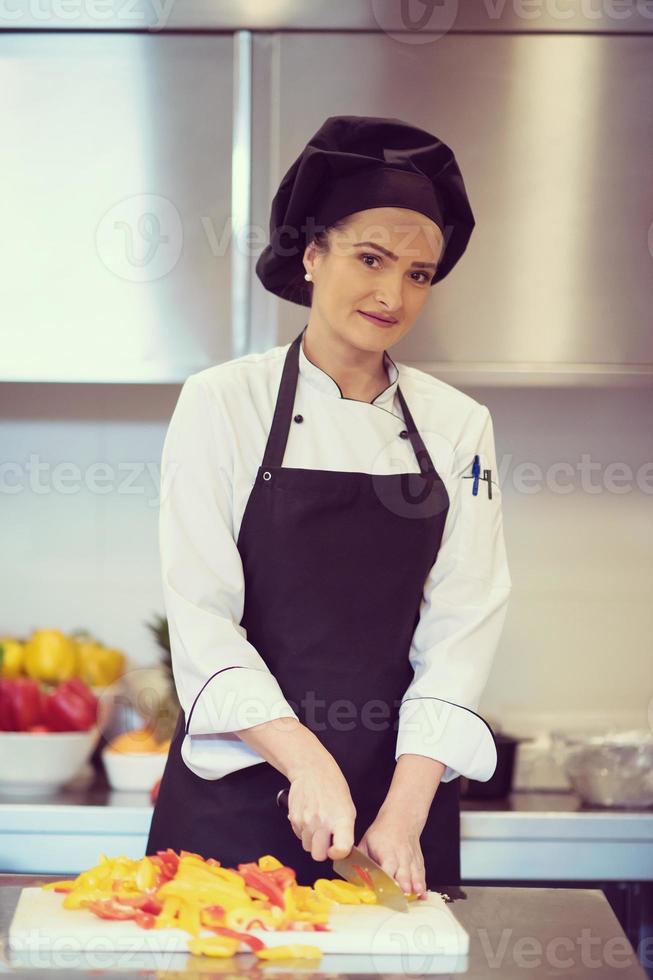 Chef cutting fresh and delicious vegetables photo