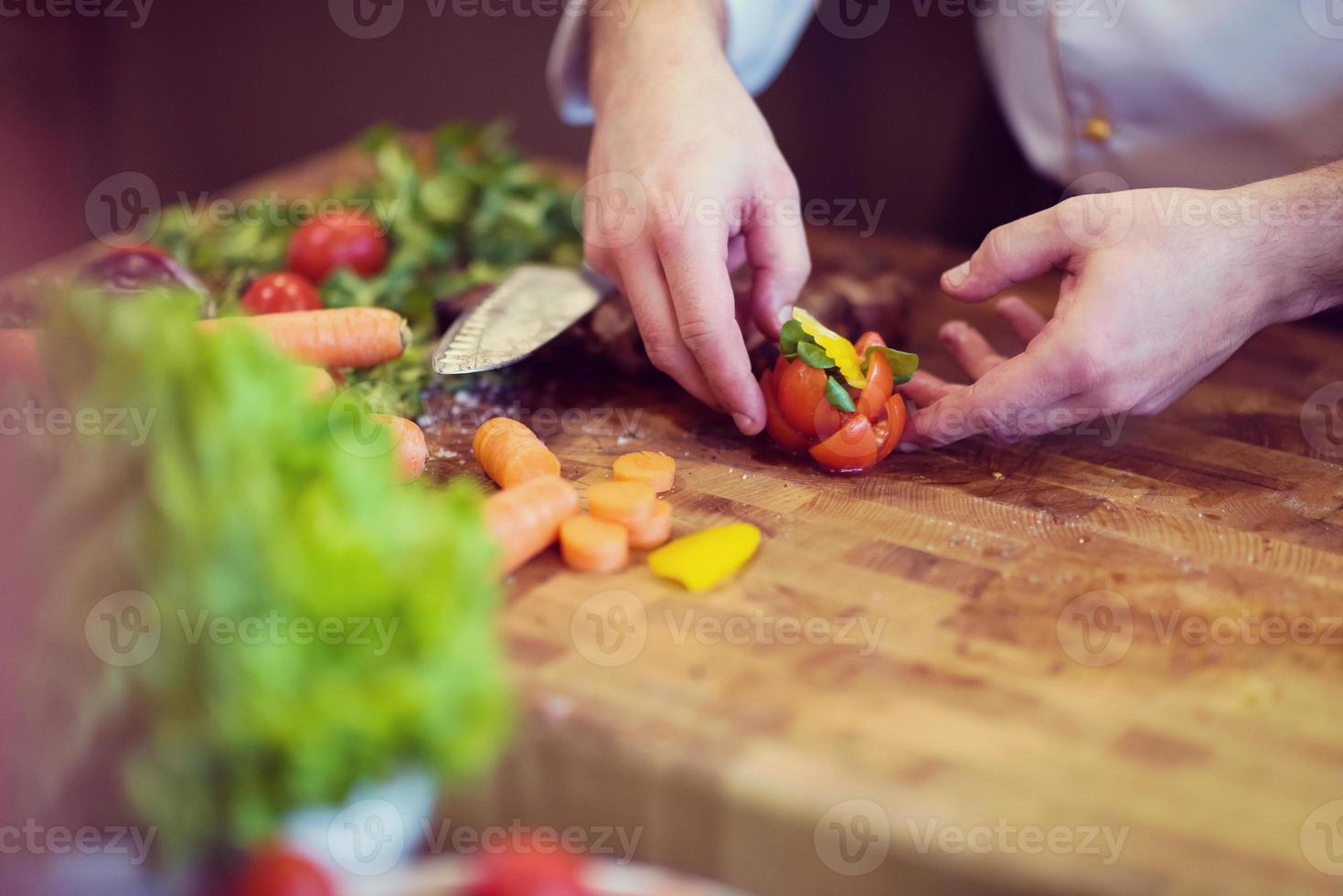closeup of Chef hands preparing beef steak photo
