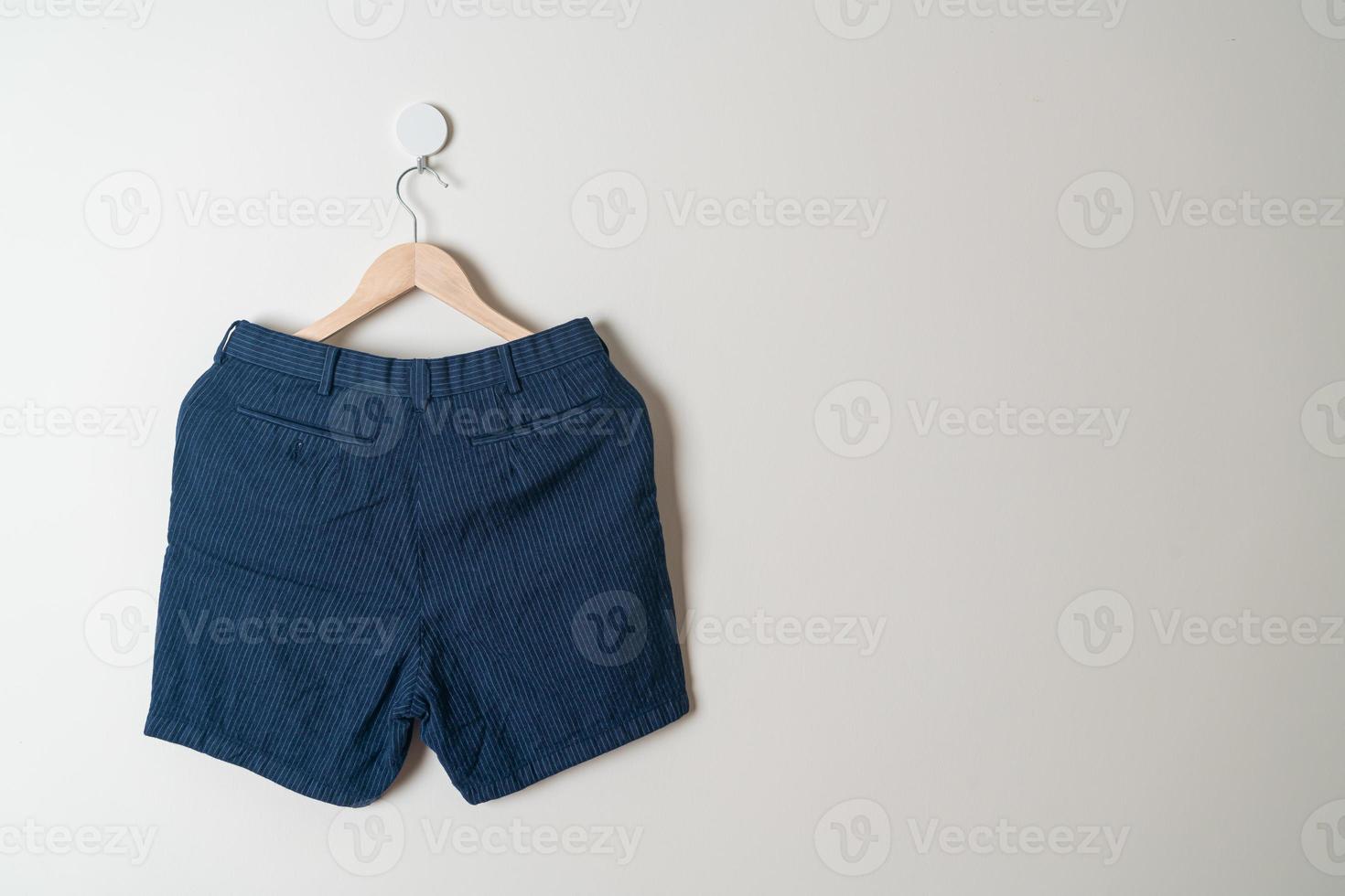 short pants hanging on wall photo