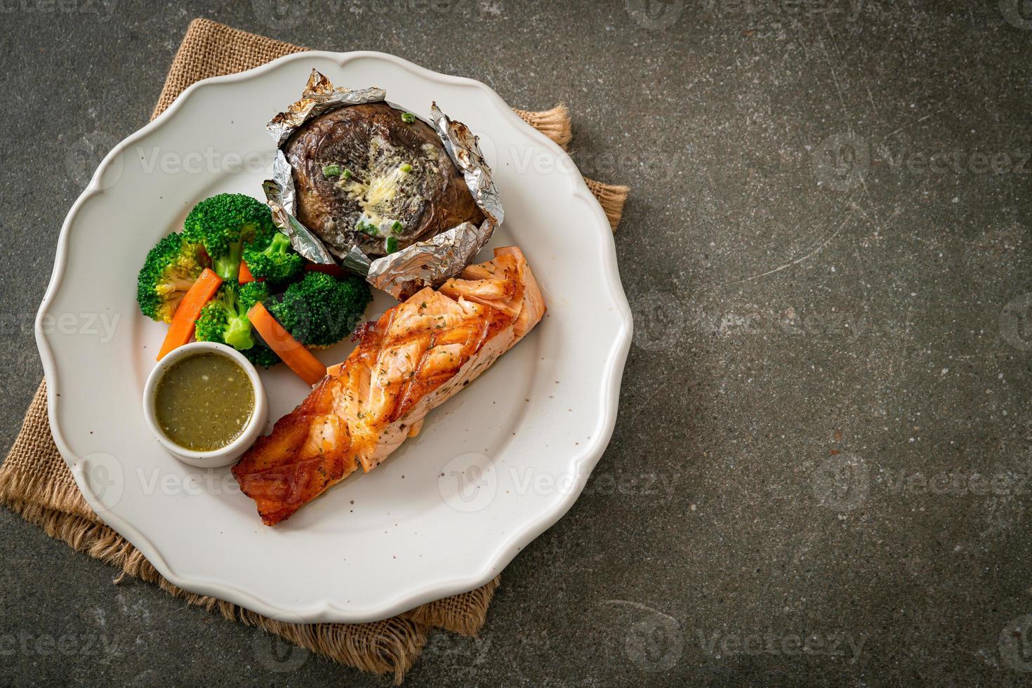 grilled salmon steak with bake potato photo