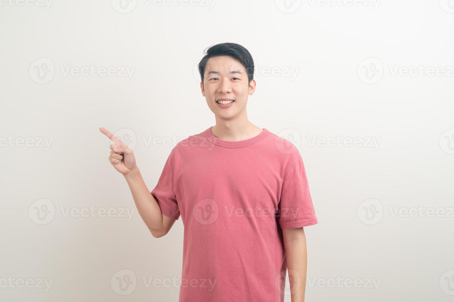 Asian man with hand pointing or presenting on white background photo