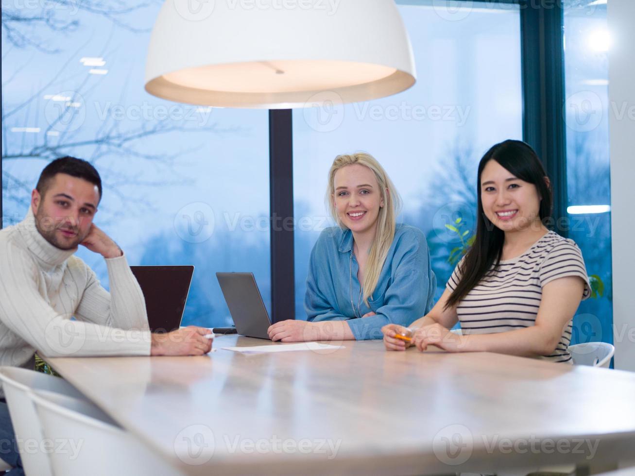 Startup business team at a meeting in modern office building photo