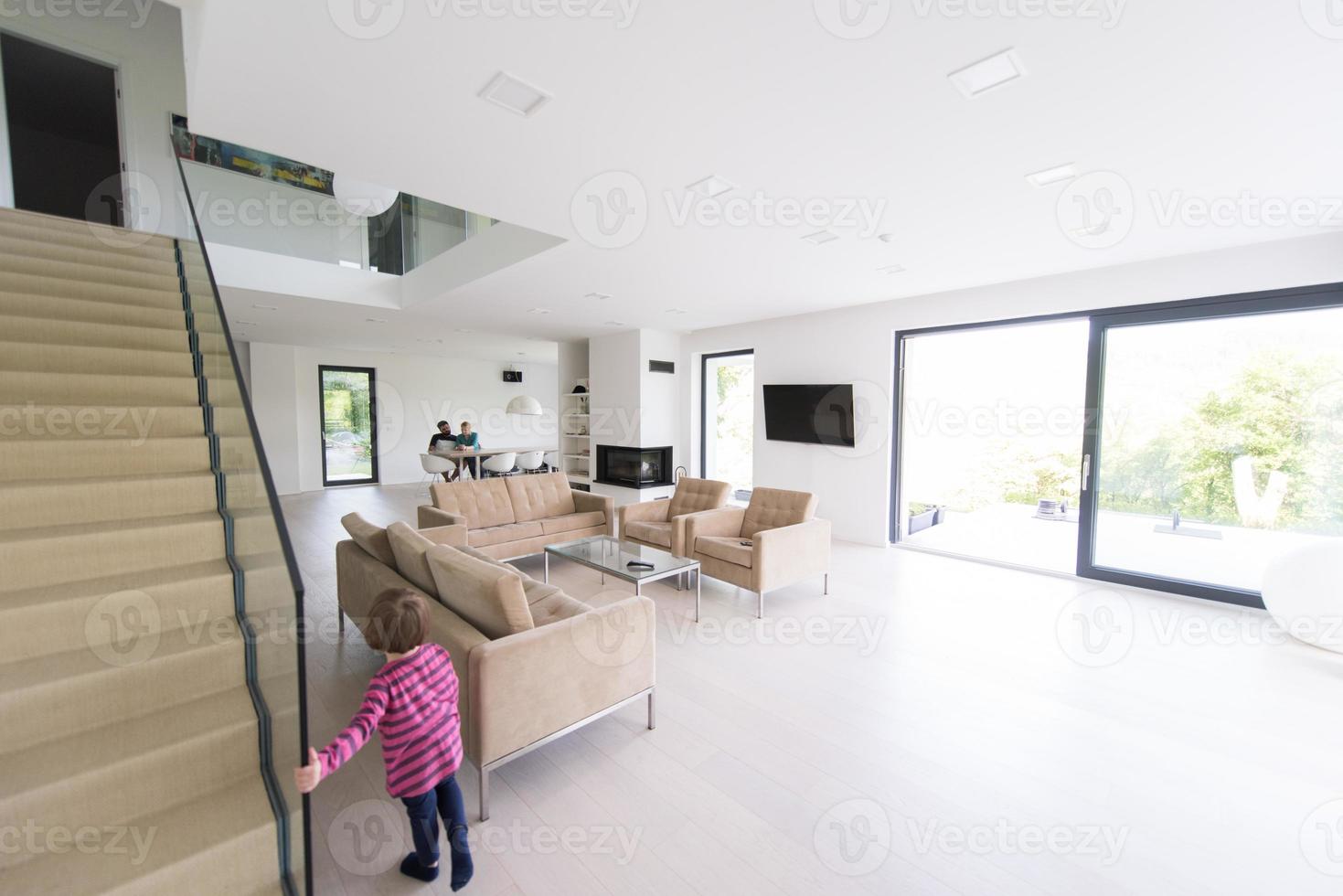family with little girl enjoys in the modern living room photo