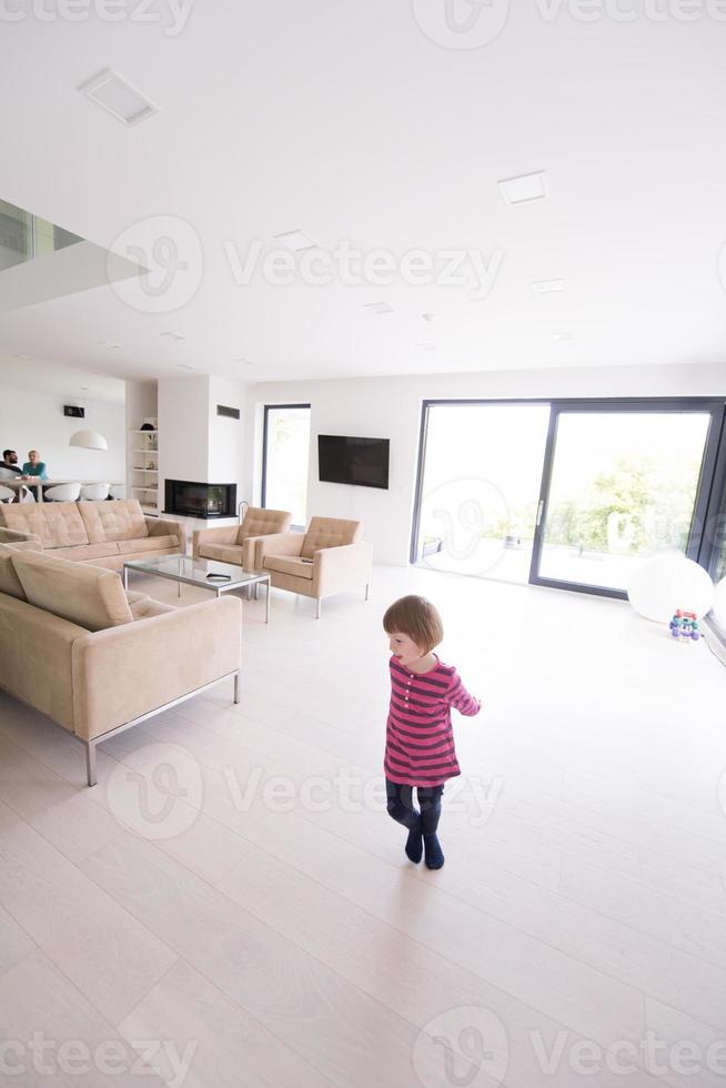 family with little girl enjoys in the modern living room photo