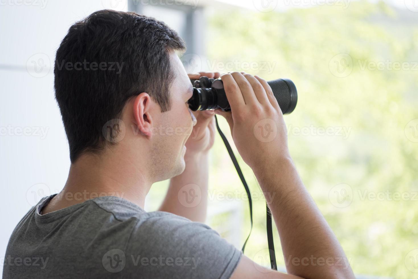 Man with binoculars photo