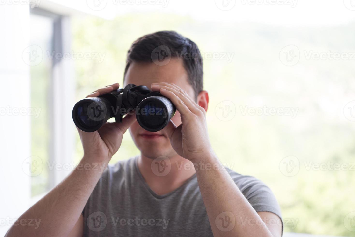 Man and binoculars photo