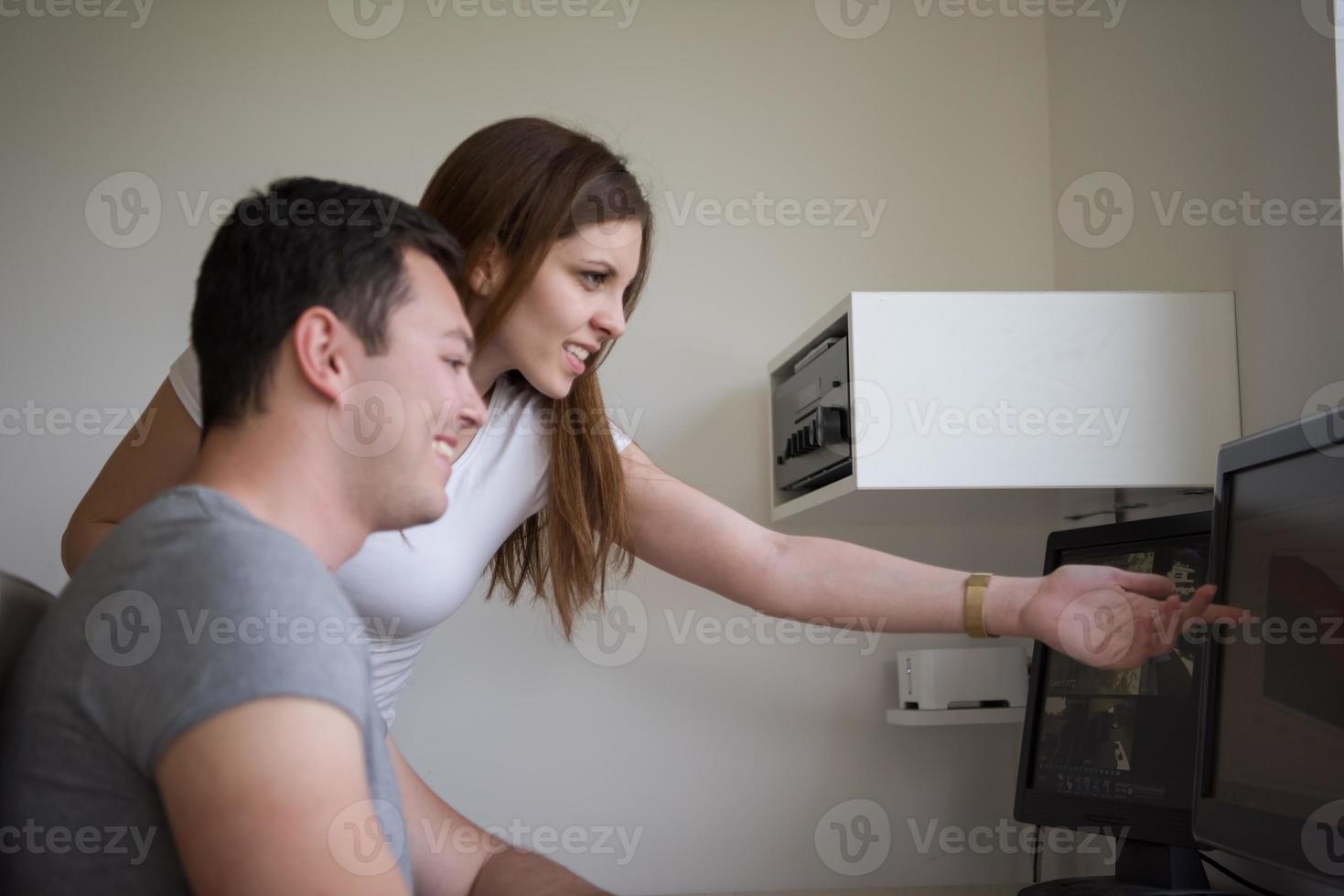 Man and woman in office photo