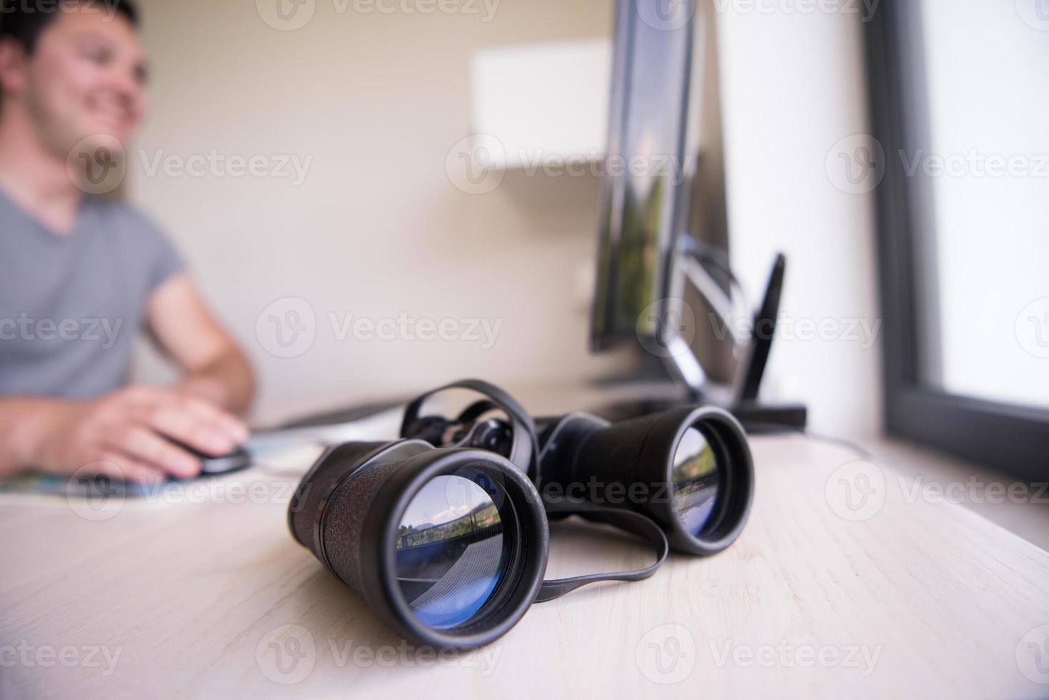 Man and binoculars photo