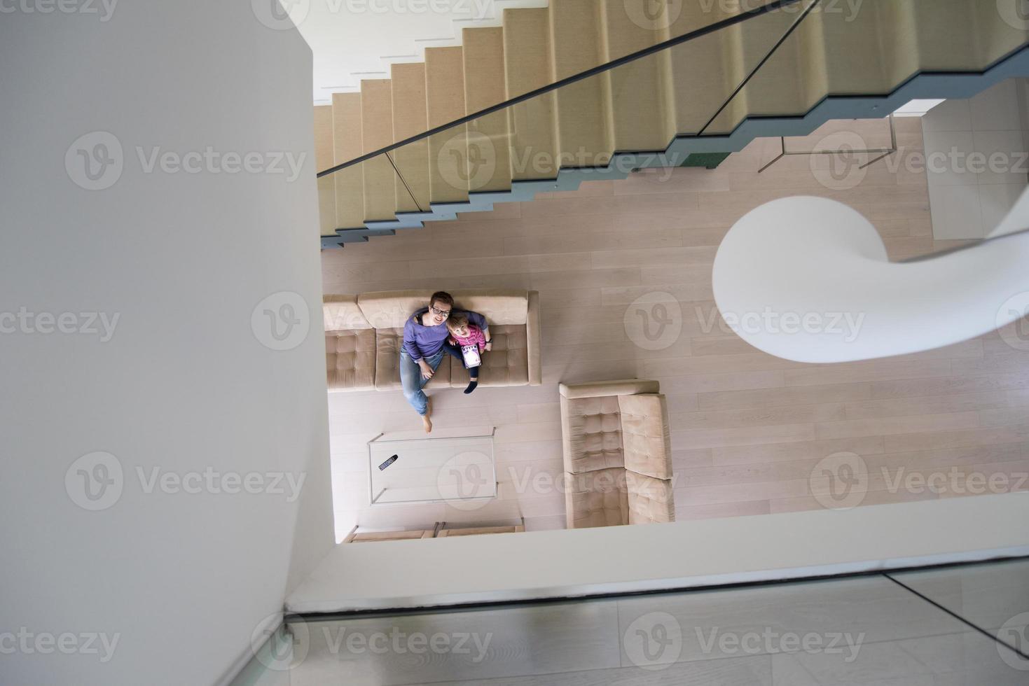 mother and her cute little daughter are using a tablet top view photo