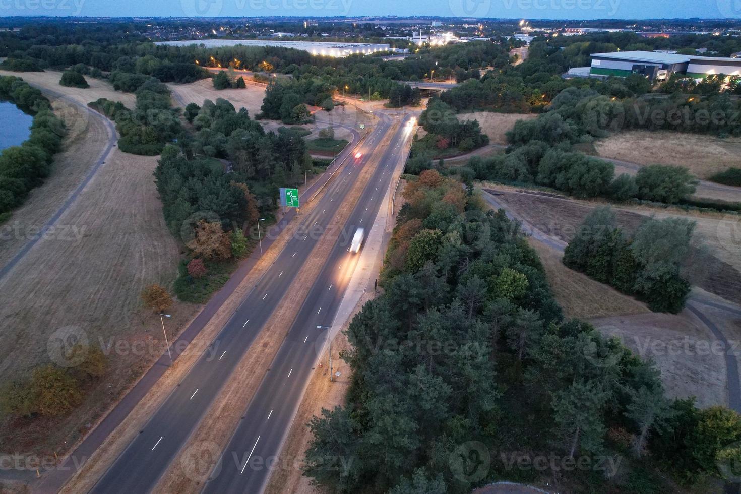 Night Aerial View of British Motorways with illuminated Roads and Traffic photo