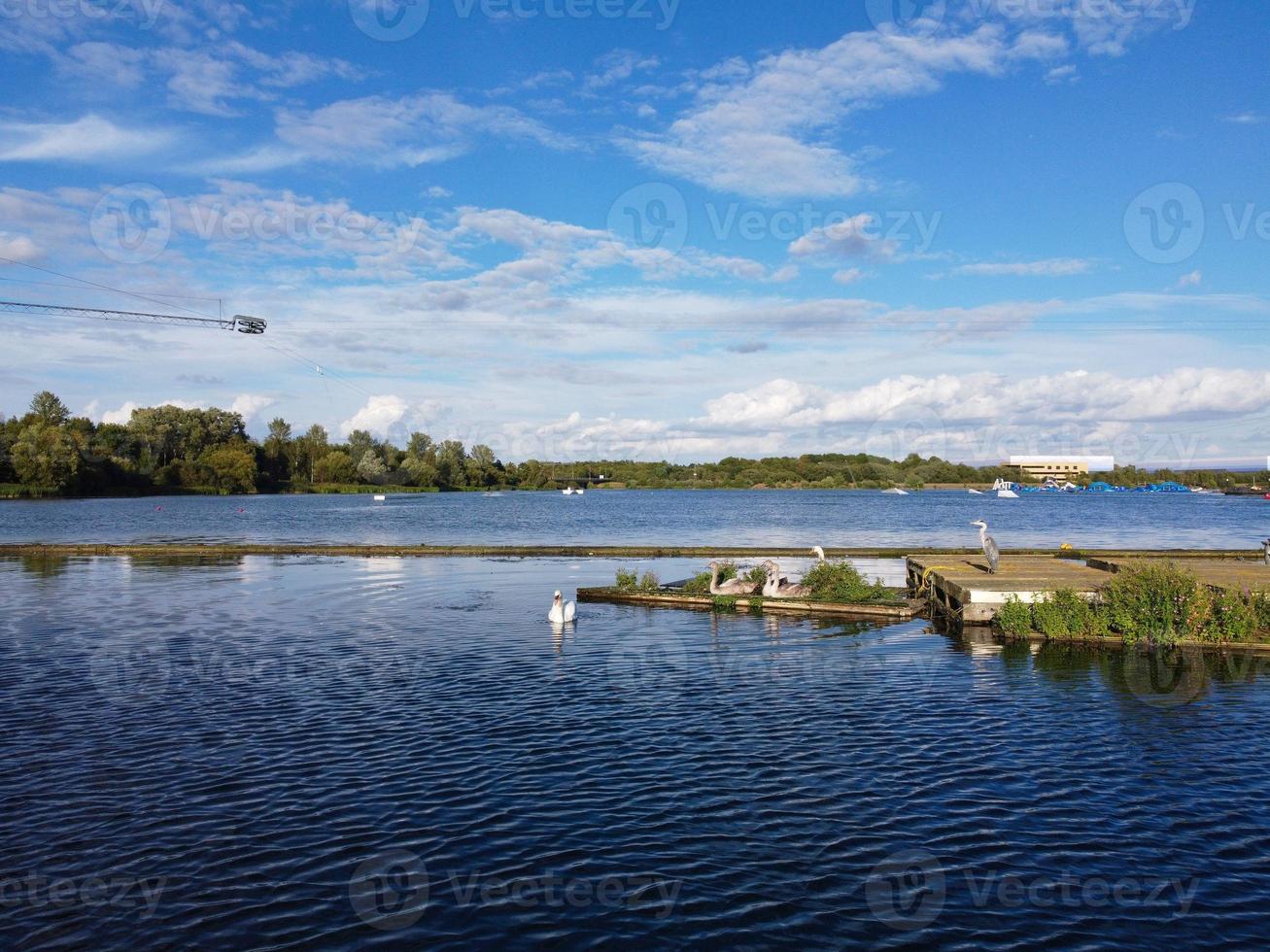 Cute Water Birds Swimming, Footage of Willen Lake and Park which is located at Milton Keynes, England. People are Enjoying at Lake on a Hot Sunny Day of Summer. Video Clip Captured on 21-8-2022 photo