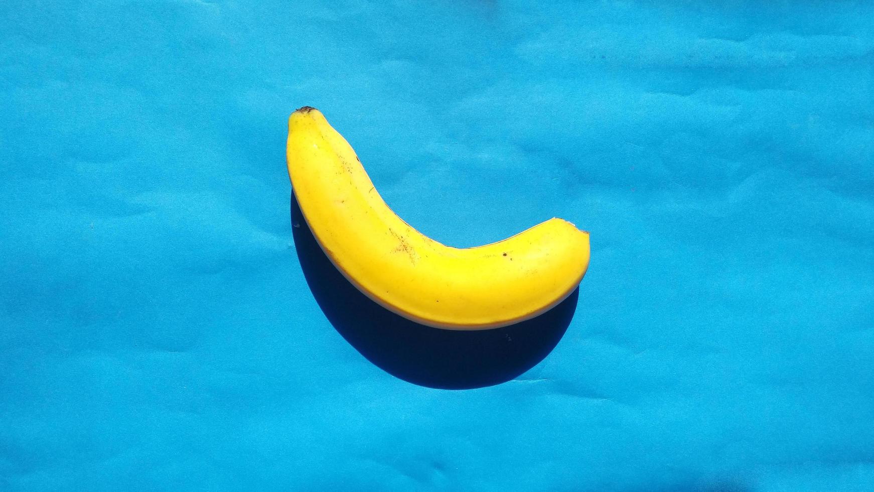 bananas on a blue background.cold tone photo