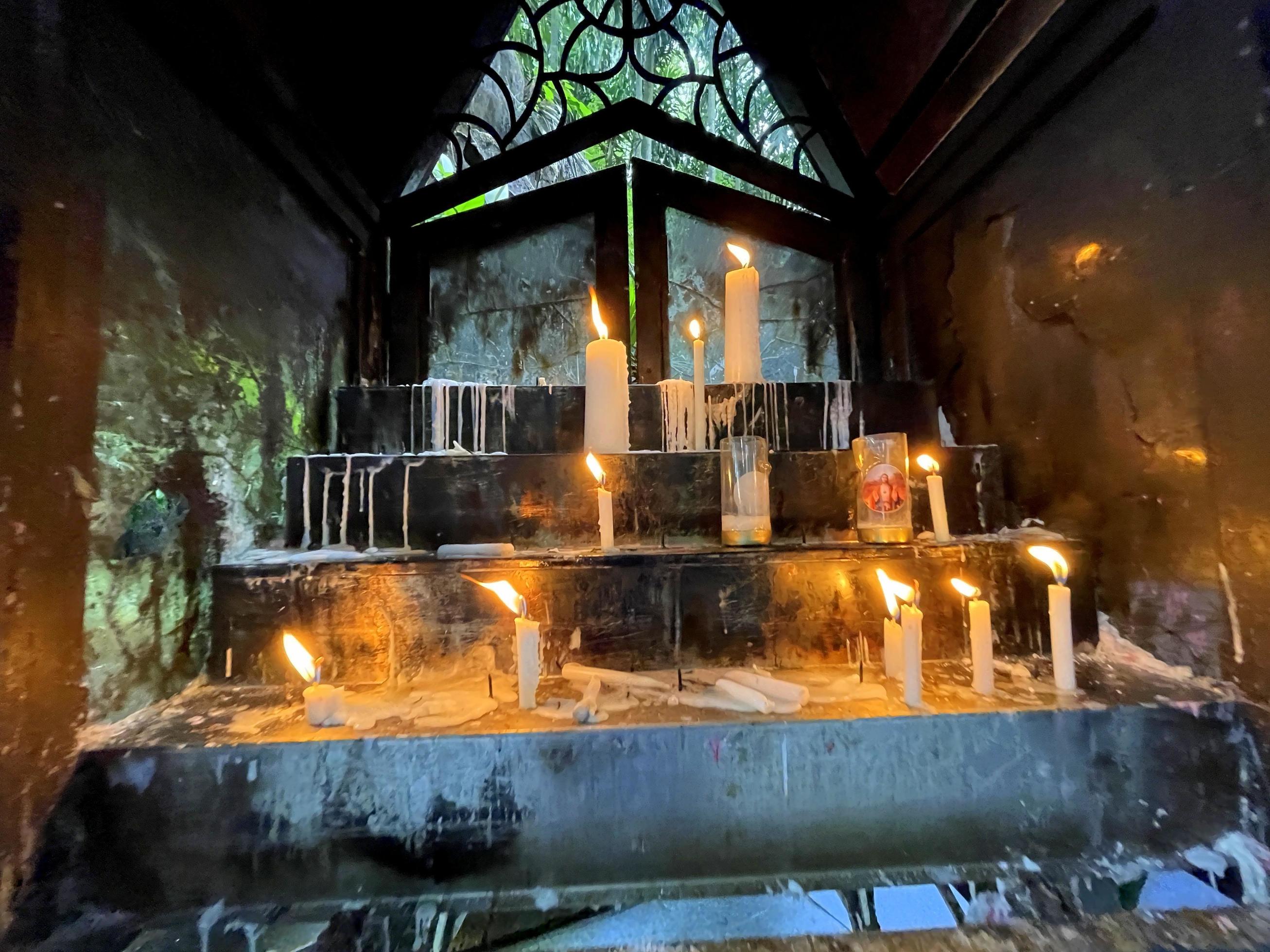 Klaten, Central Java, Indonesia, 2022, Bunch of prayers candle flames