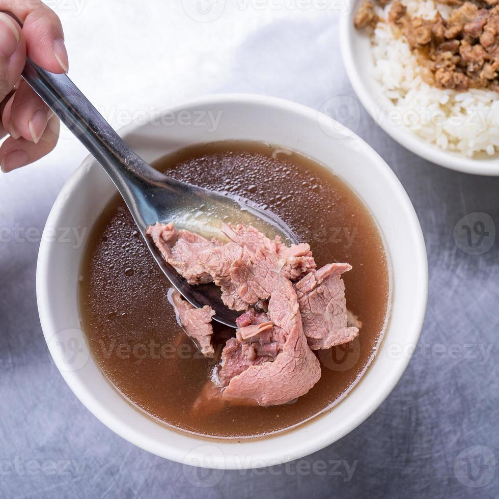 Beef soup - famous food in Taiwan, Asia, Asian Taiwanese street delicacy cuisine, close up, lifestyles, traditional breakfast in Tainan. photo