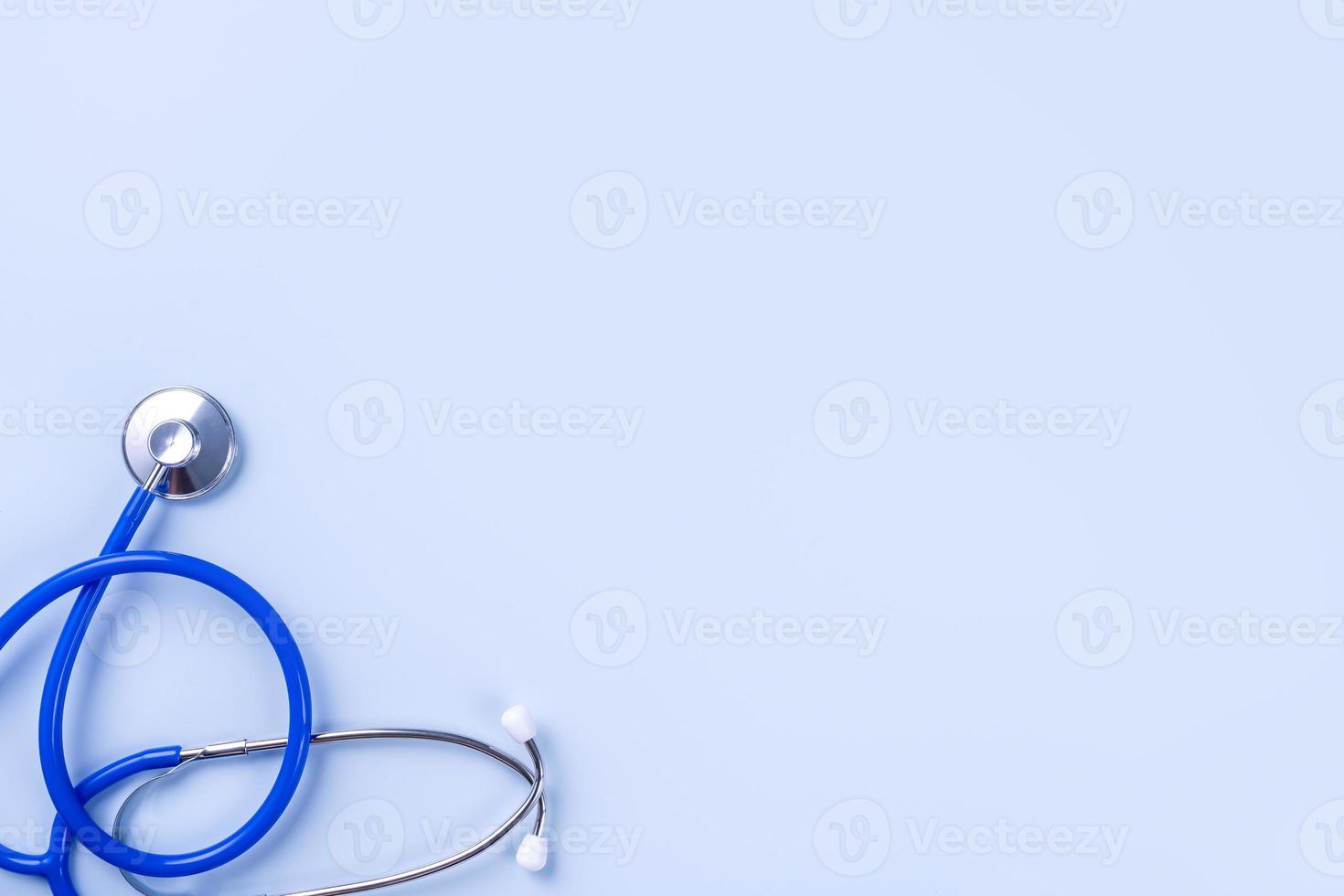 Blue mask - medical equipment with stethoscope, concept of world disease pandemic infection and prevention, top view, flat lay, overhead design photo