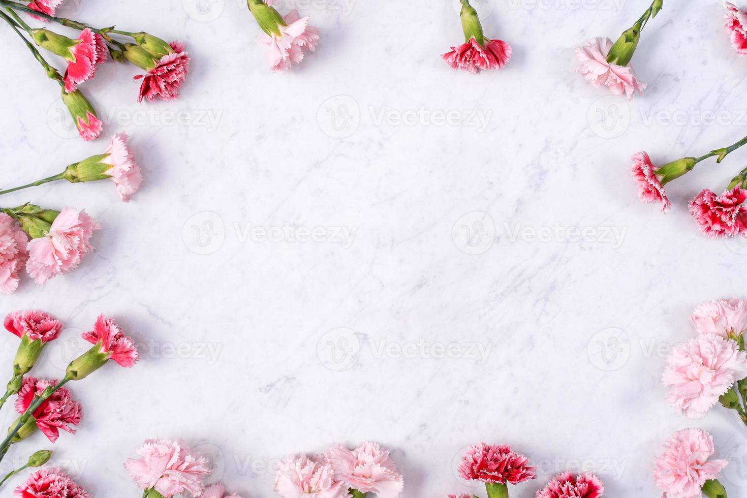 Mother's Day, Valentine's Day background design concept, beautiful pink, red carnation flower bouquet on marble table, top view, flat lay, copy space. photo