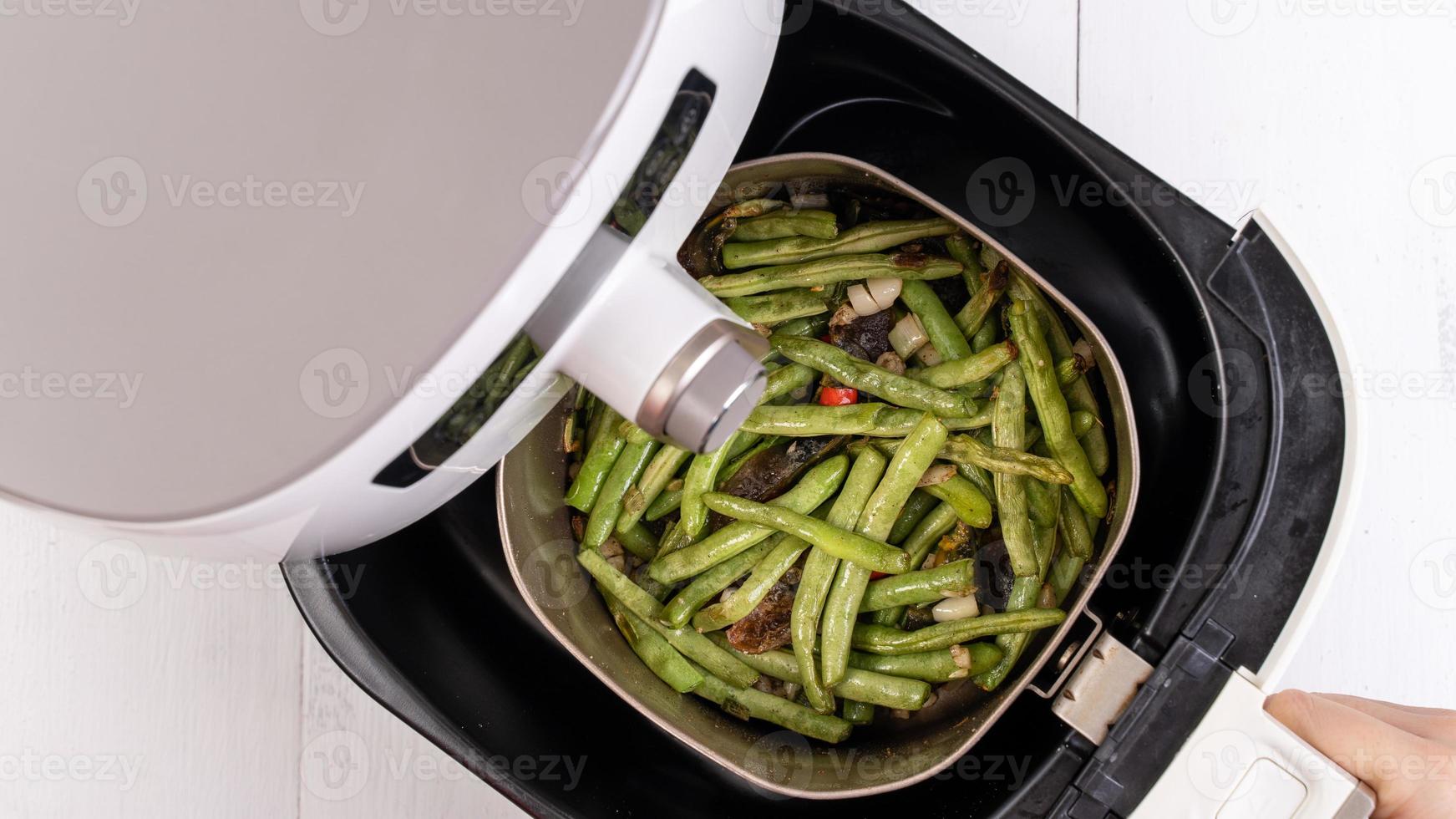 Air fryer meal, cooking green bean, pidan dishes cookery with Airfryer at home, delicious cuisine in Taiwan, Asia, Asian Taiwanese food, close up, top view. photo