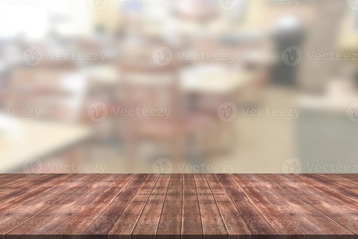 Wooden table with blur restaurant background photo