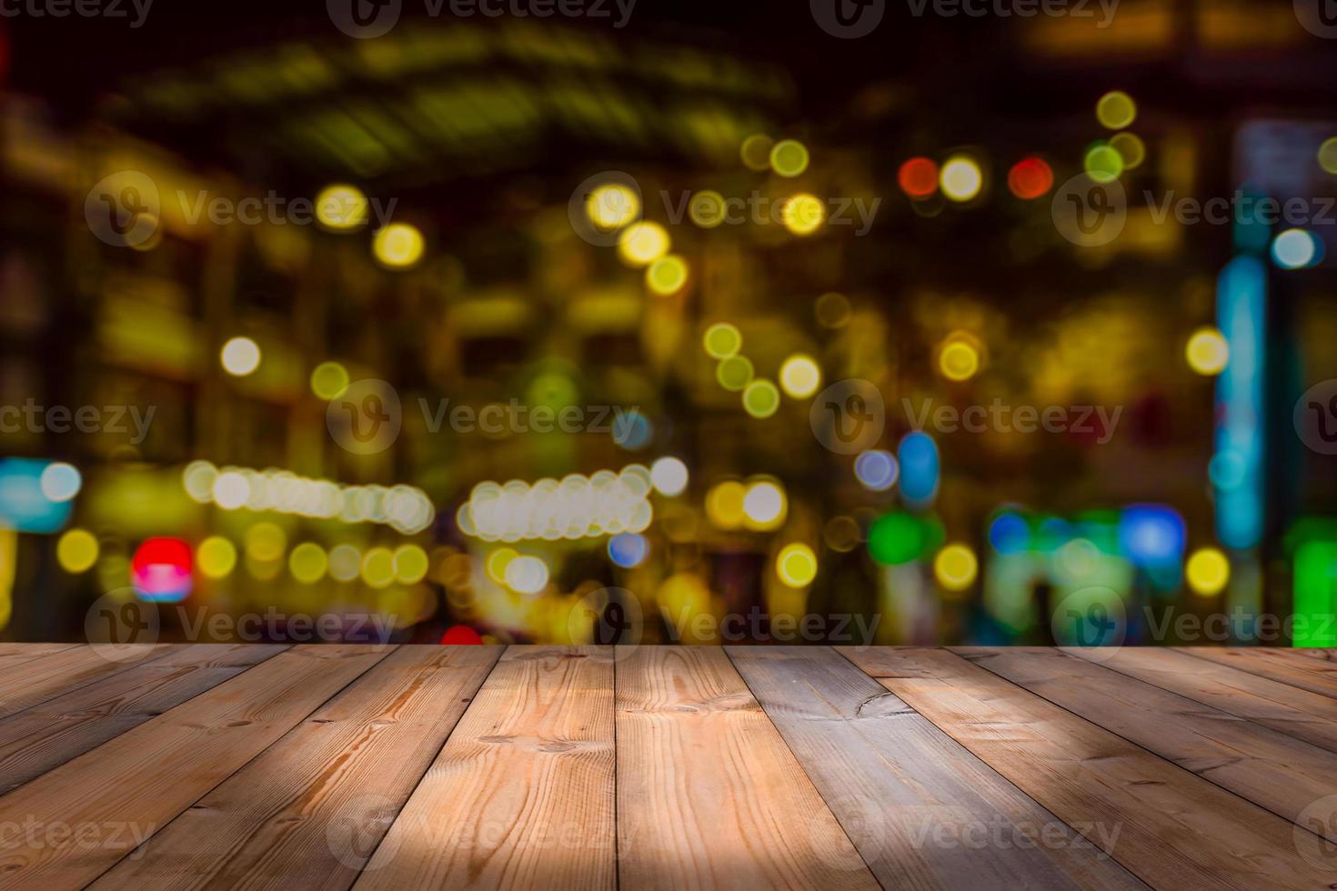 Wooden table with blur bokeh background photo
