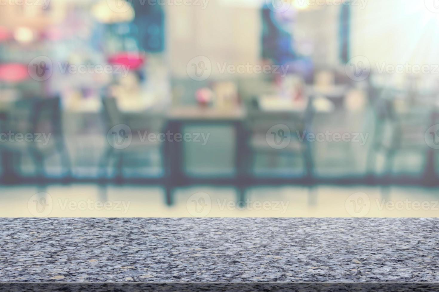 Marble table with restaurant blur background photo