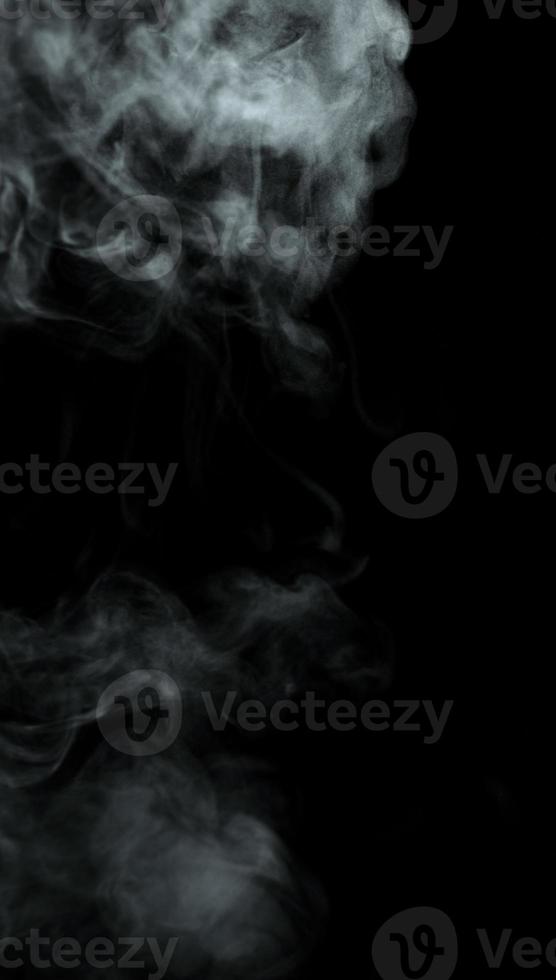 Abstract powder or smoke isolated on black background photo