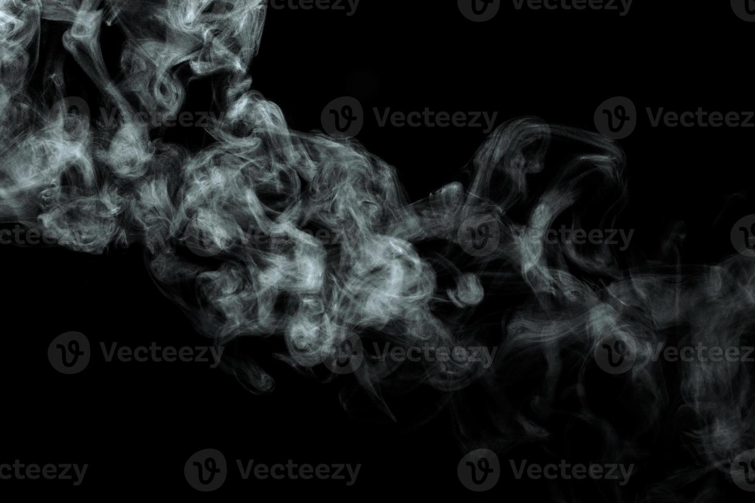 Abstract powder or smoke isolated on black background photo