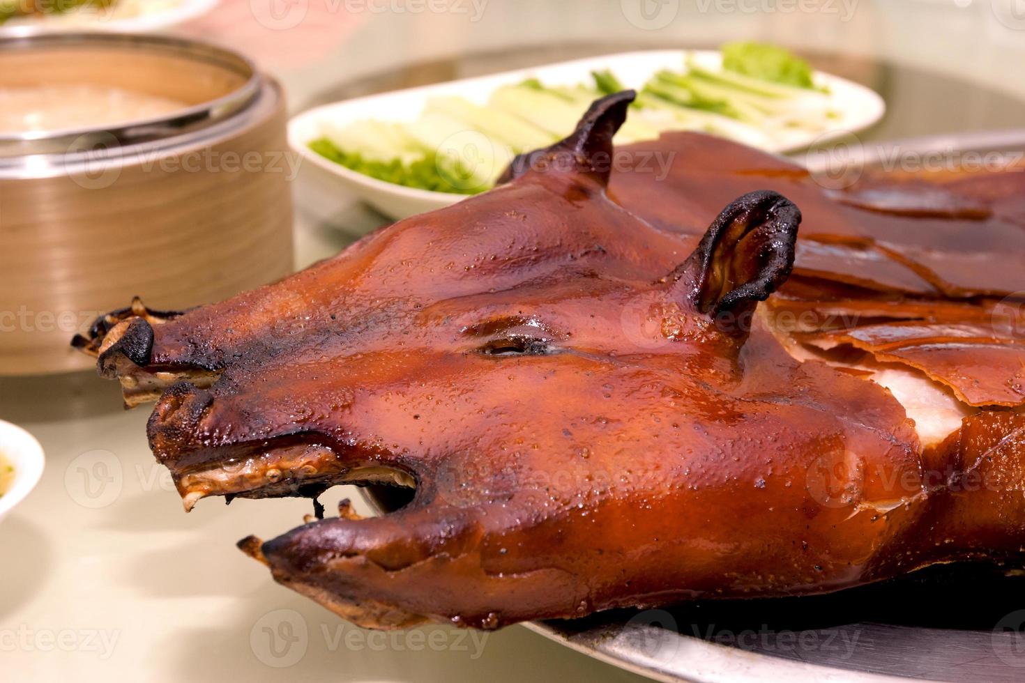 Barbecued suckling pig in restaurant photo