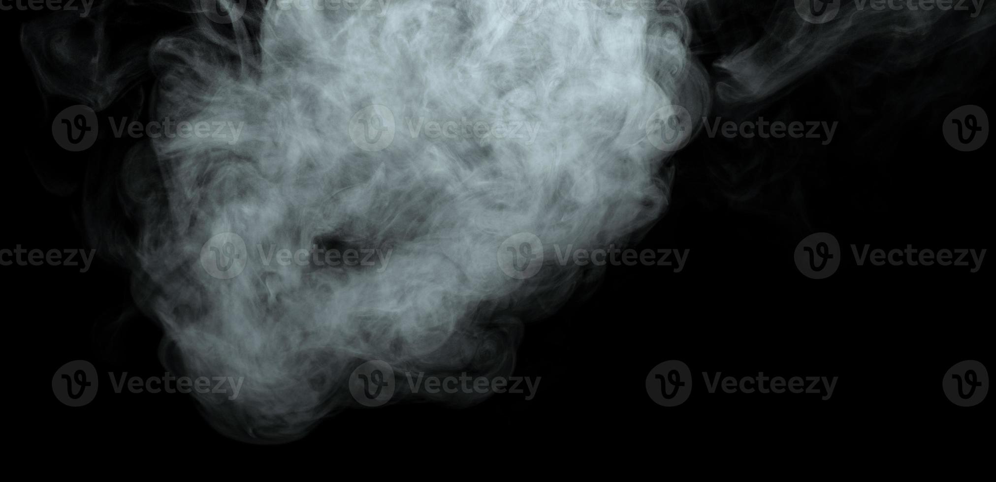 Abstract powder or smoke isolated on black background photo