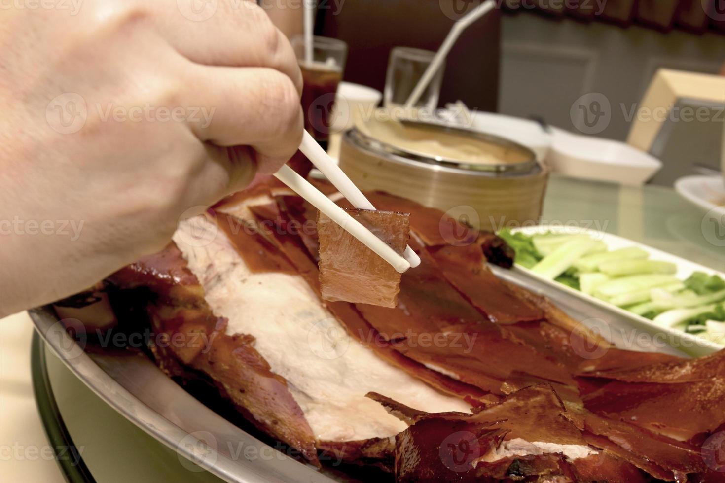 Barbecued suckling pig in restaurant photo