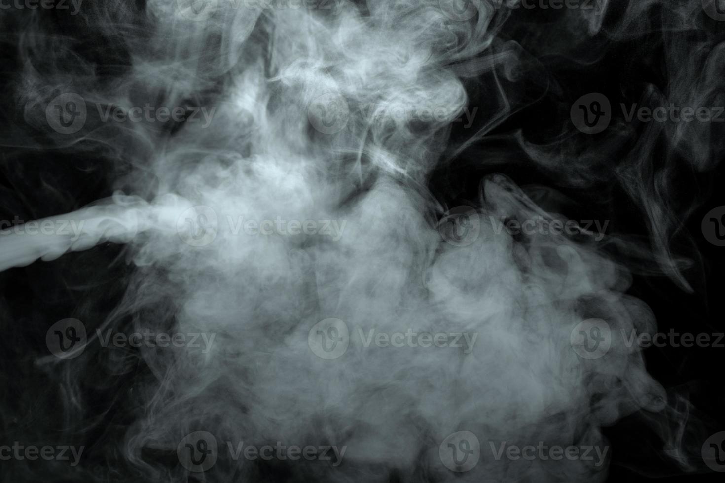 Abstract powder or smoke isolated on black background photo