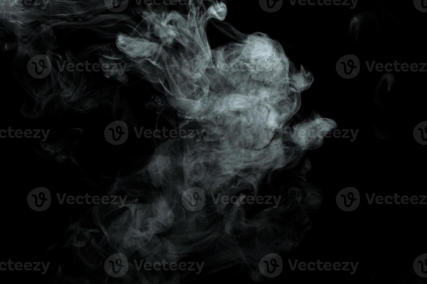 Abstract powder or smoke isolated on black background photo