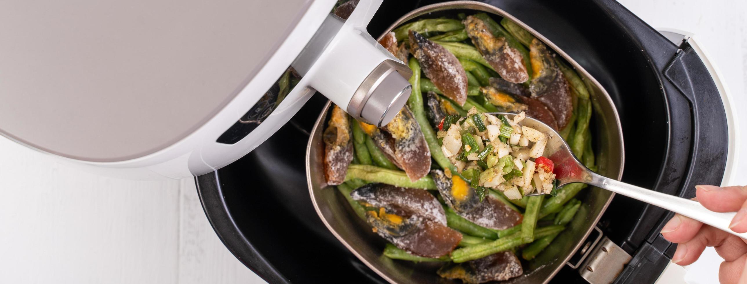 Air fryer meal, cooking green bean, pidan dishes cookery with Airfryer at home, delicious cuisine in Taiwan, Asia, Asian Taiwanese food, close up, top view. photo