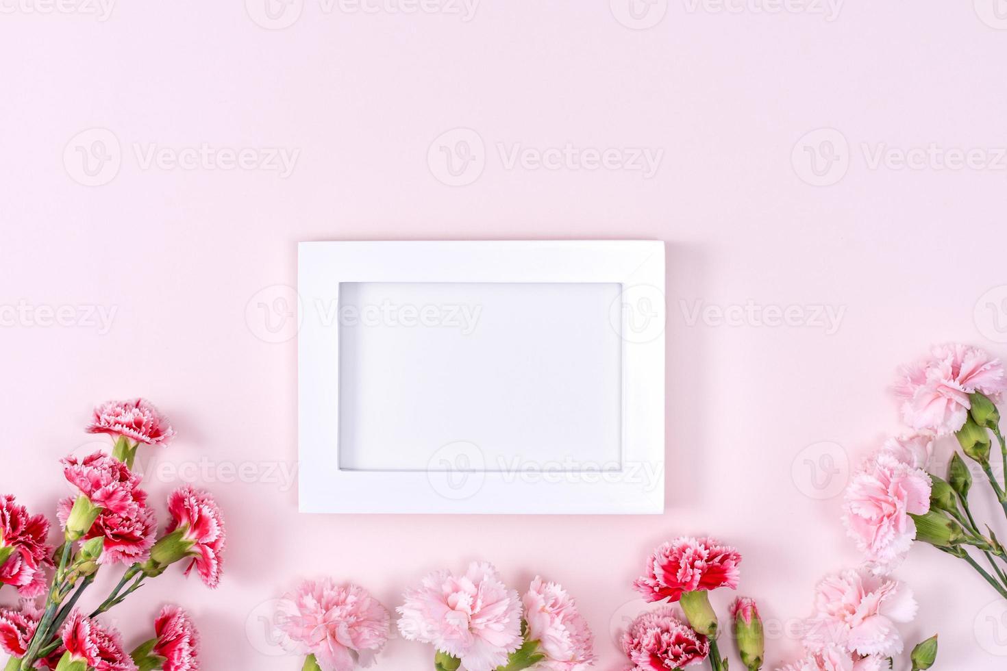 Mother's Day, Valentine's Day background design concept, beautiful pink, red carnation flower bouquet on pink table, top view, flat lay, copy space. photo