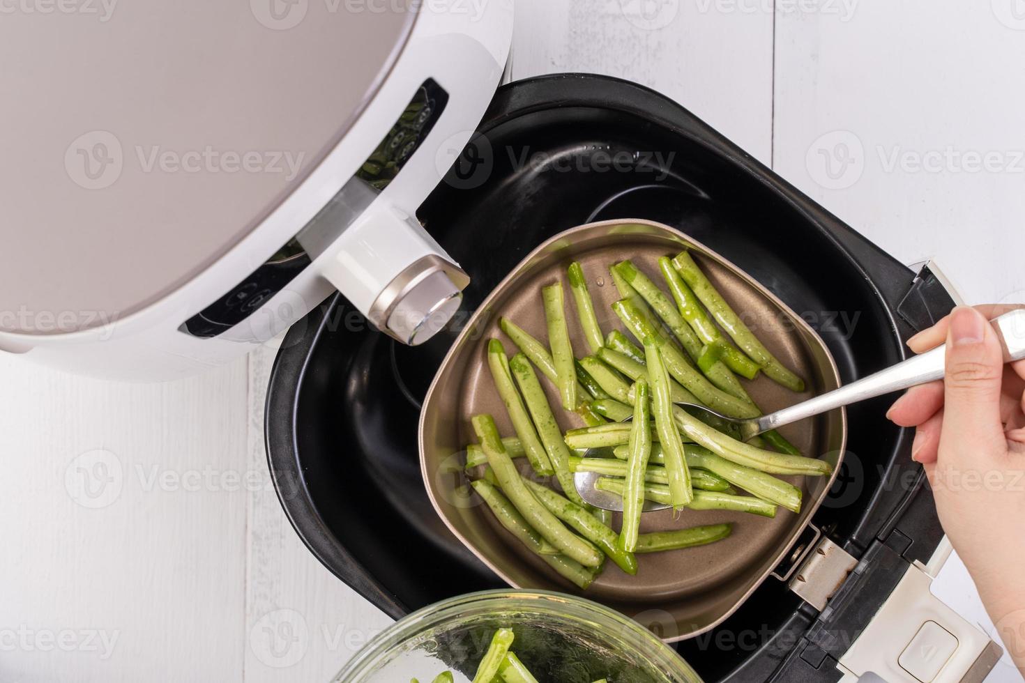 Air fryer meal, cooking green bean, pidan dishes cookery with Airfryer at home, delicious cuisine in Taiwan, Asia, Asian Taiwanese food, close up, top view. photo
