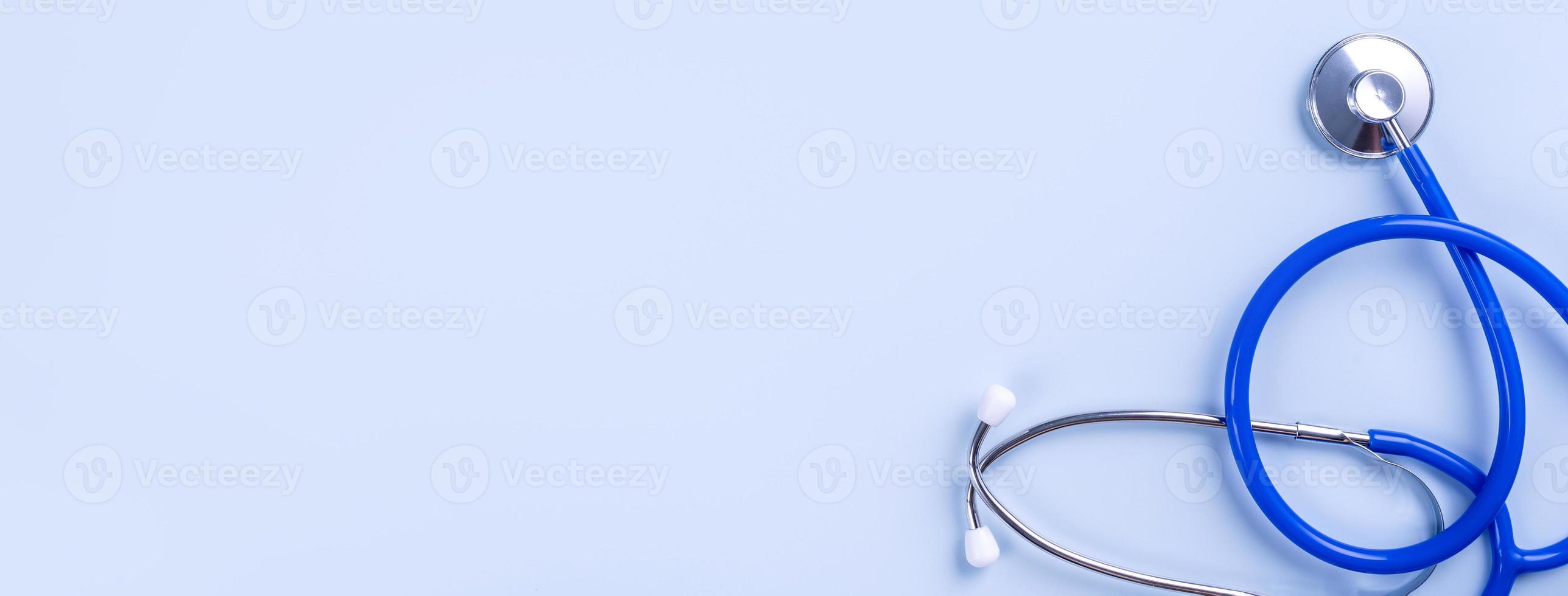 Blue mask - medical equipment with stethoscope, concept of world disease pandemic infection and prevention, top view, flat lay, overhead design photo