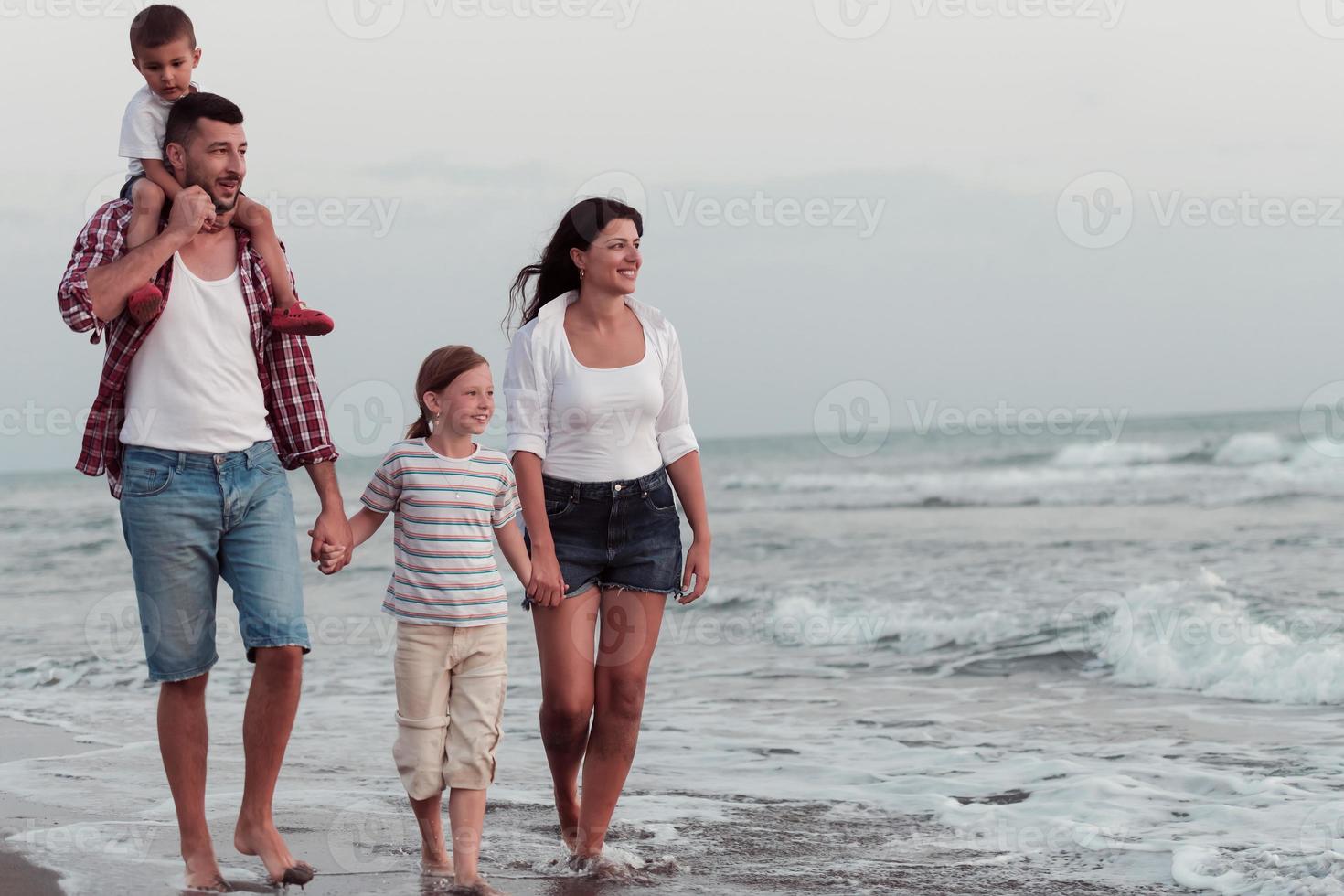 Family have fun and live healthy lifestyle on beach. Selective focus photo